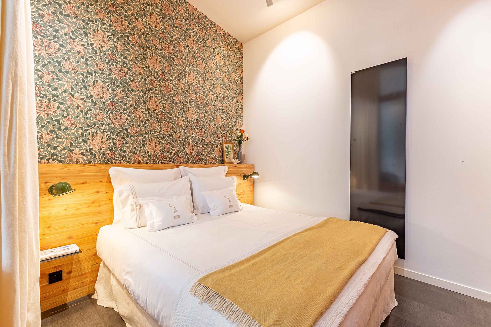 Comfortable bedroom is bright and inviting.