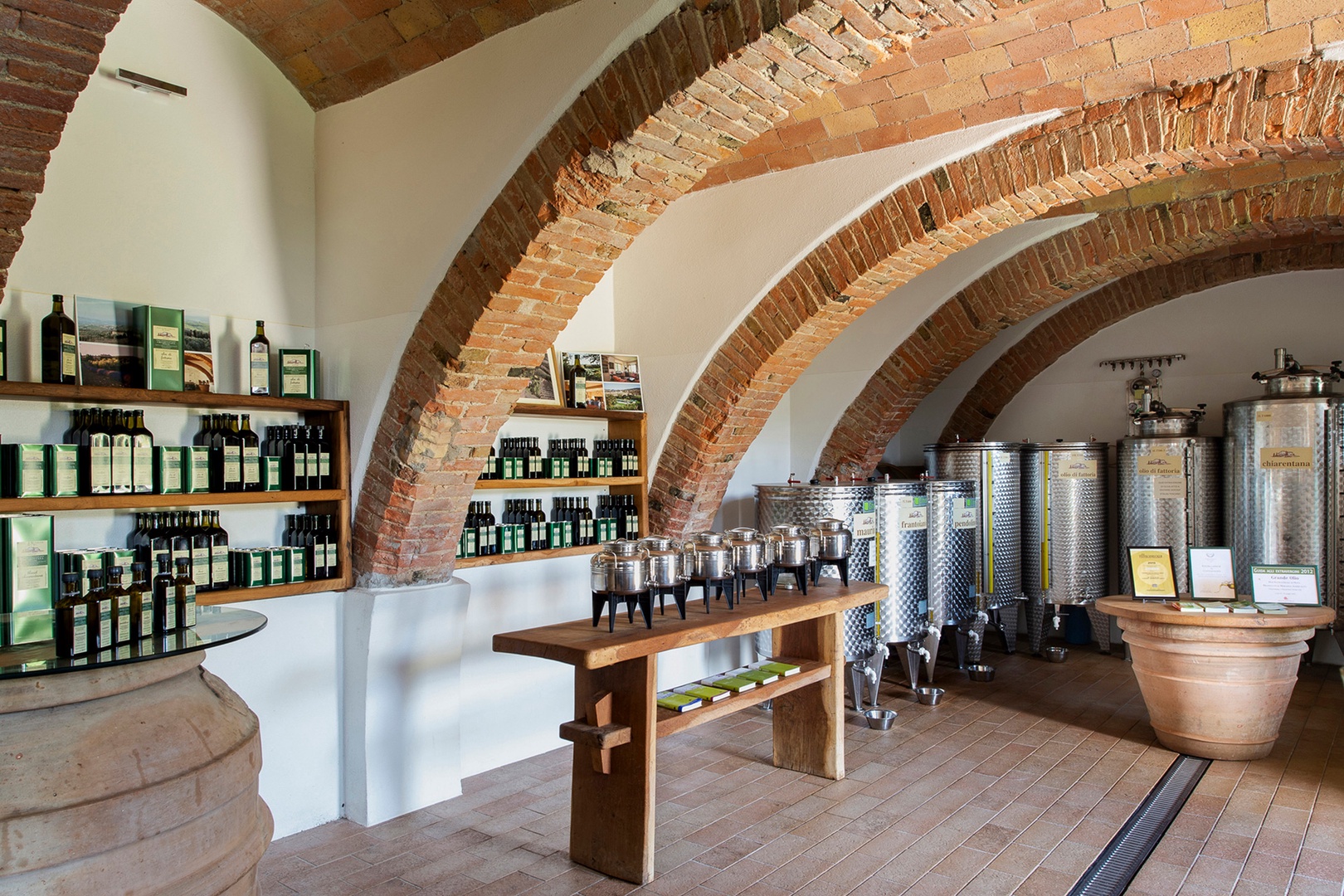 Display of local olive oil ready for tasting.