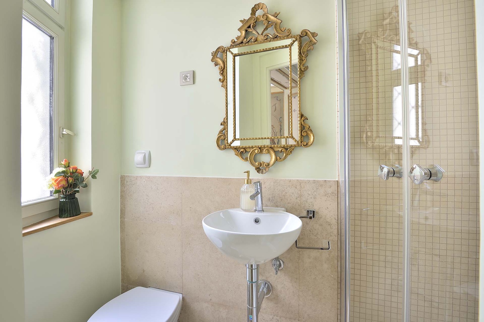 Full bathroom with shower located off living room.