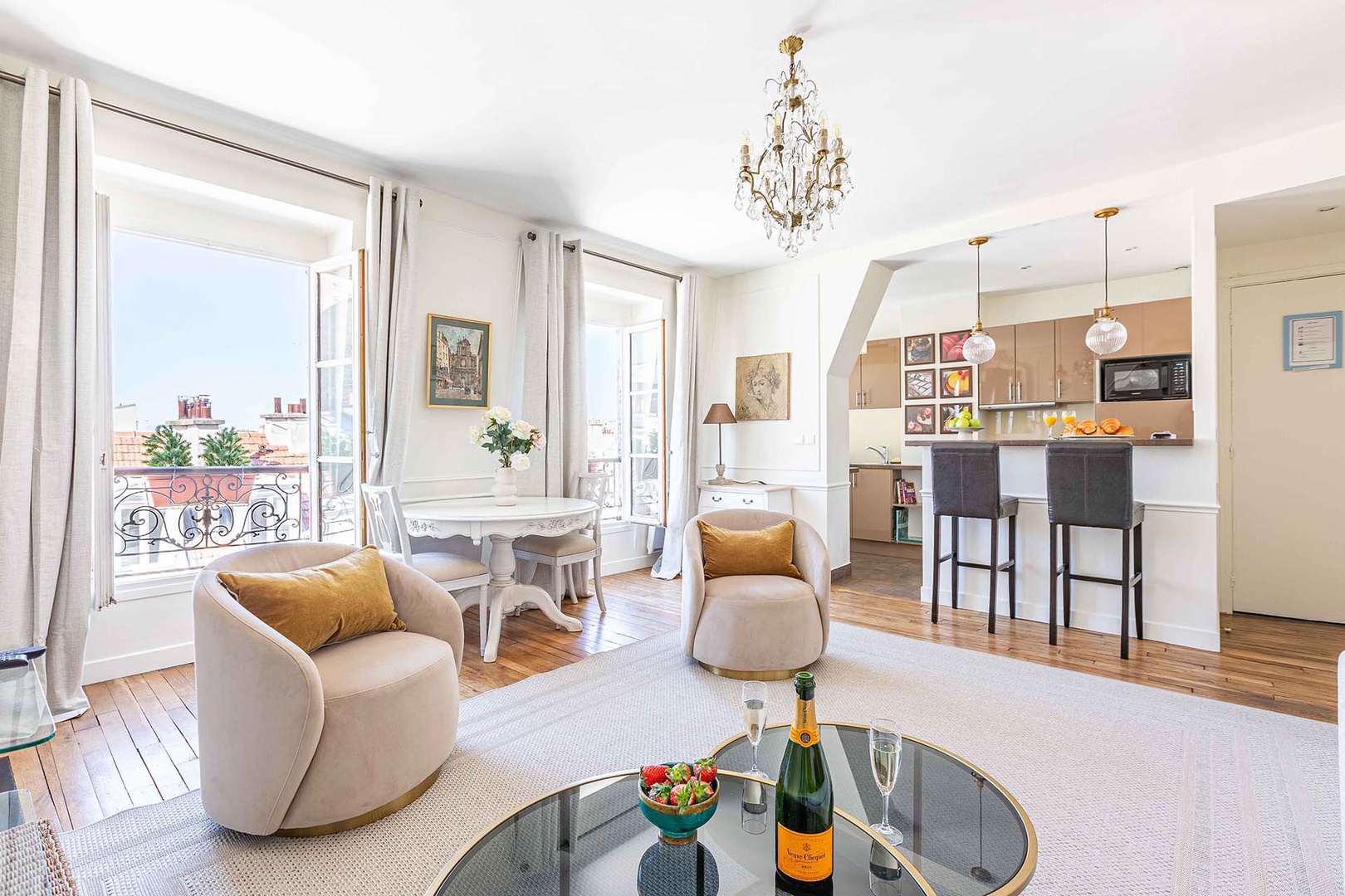 Relax in your elegant Parisian living space with champagne, plush seating, and stunning city views through French doors.
