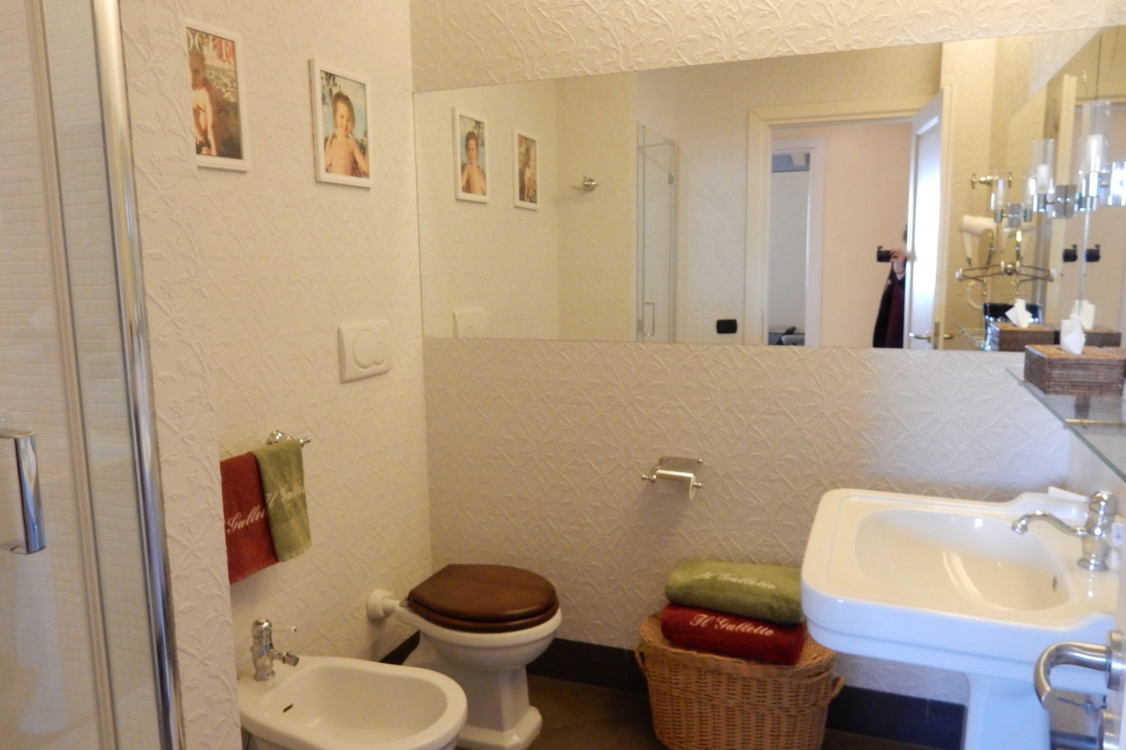 En suite bathroom has large shower, toilet, sink, bidet.