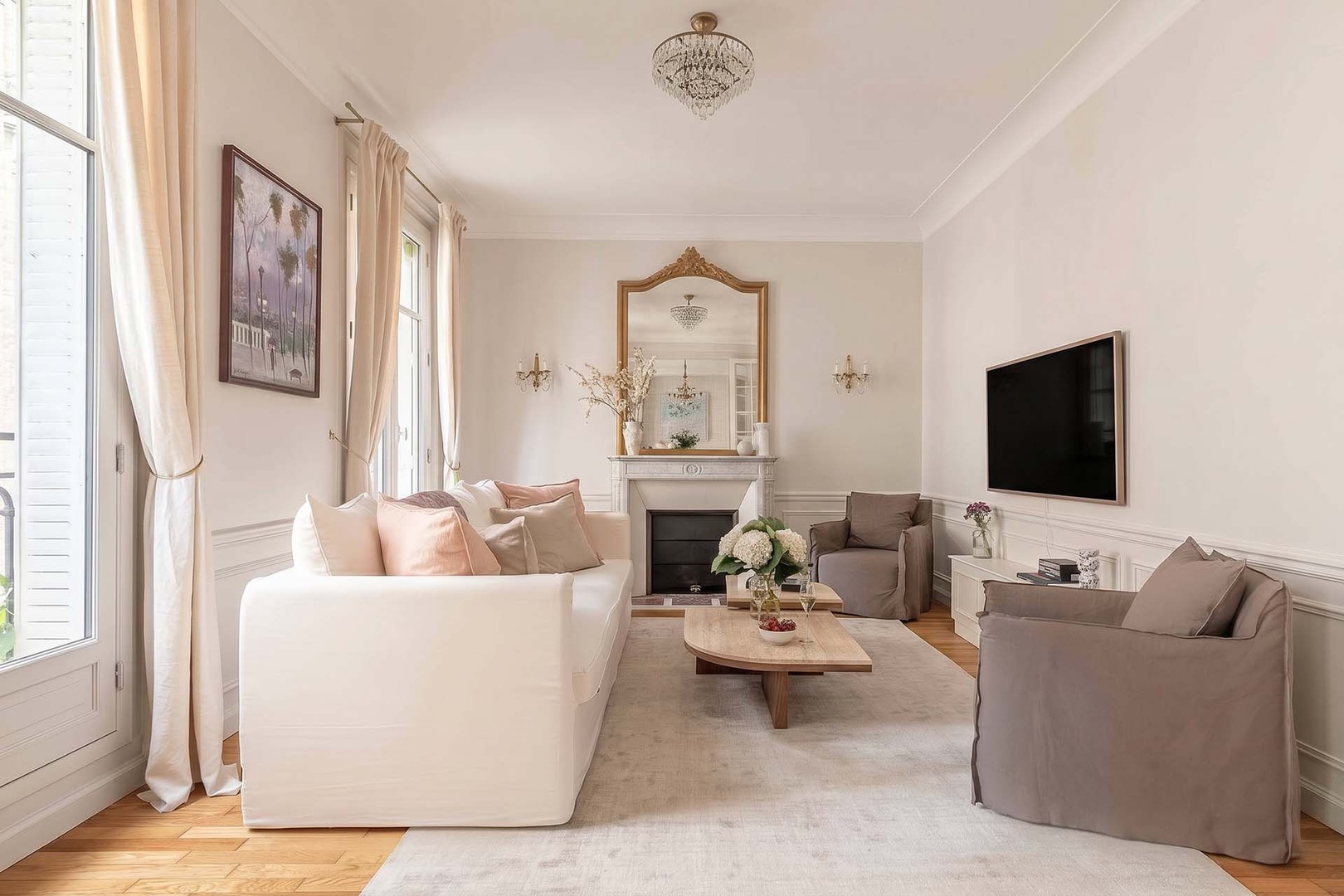 An inviting living room with elegant Parisian decor.