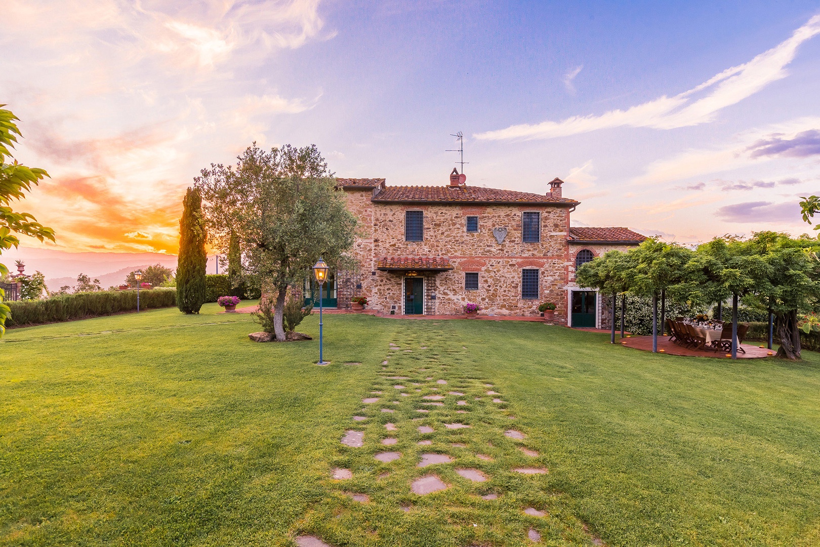 Regina is located on a large property with manicured landscaping. It adjoins olive groves.