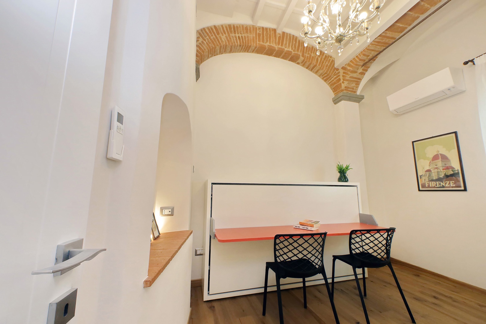 Cleverly designed desk in the office converts into a single bed creating a third bedroom.
