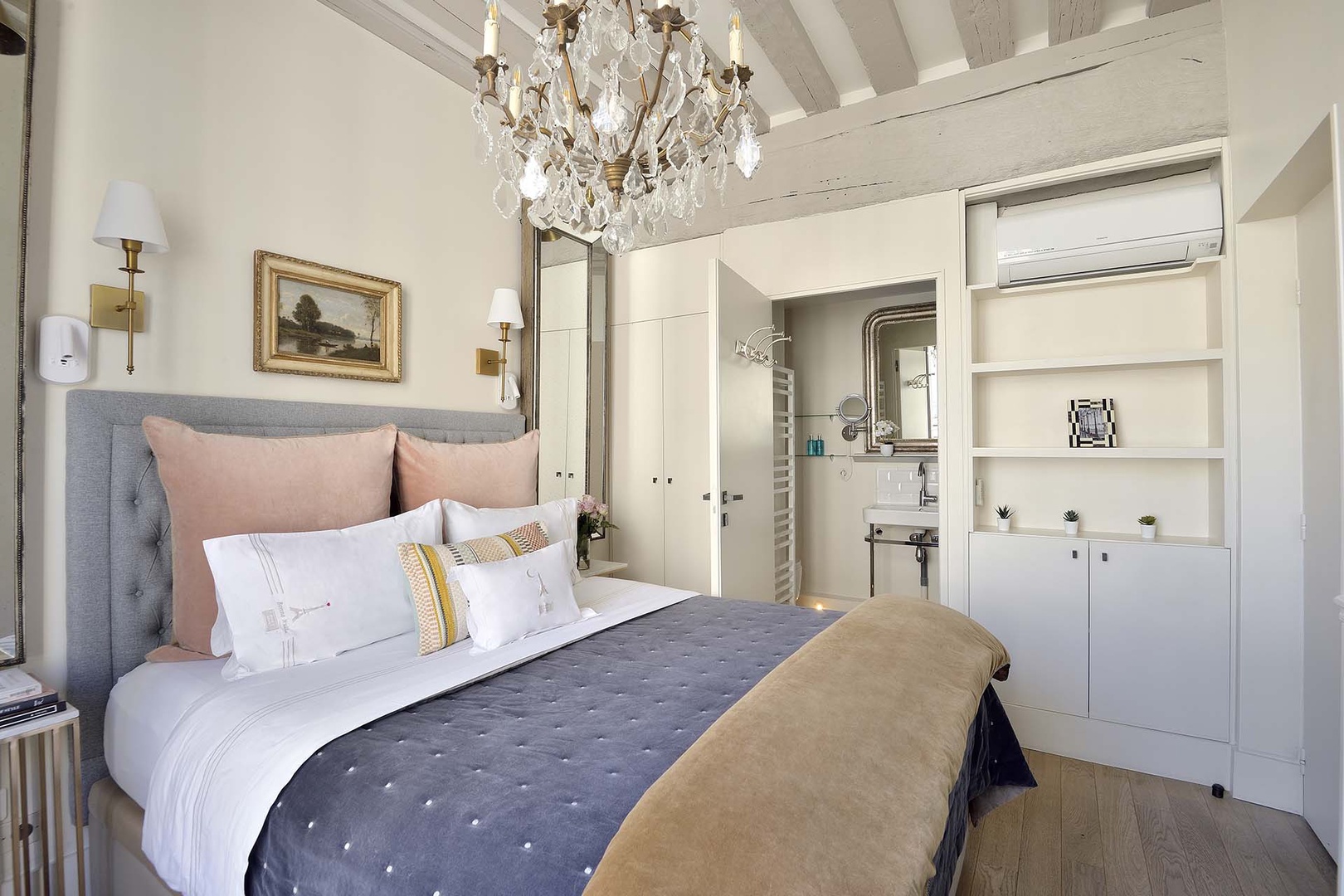 The bedroom has an en suite bathroom and ample storage.