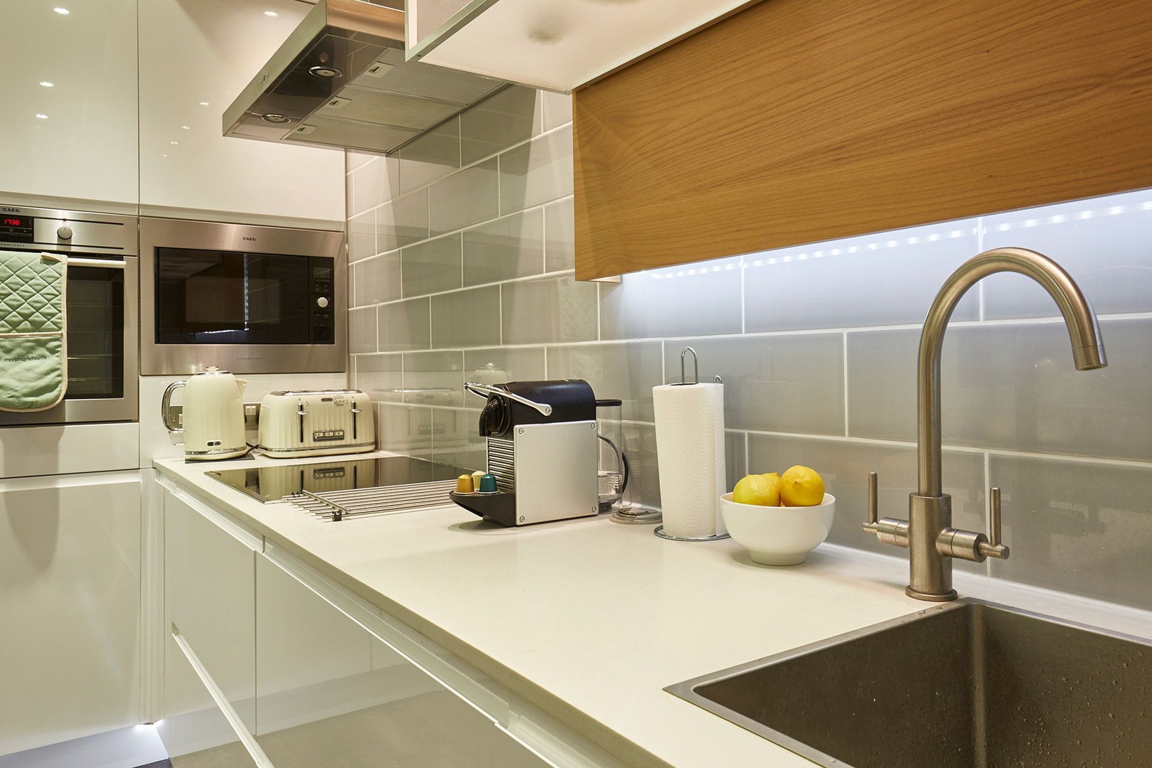 View of the stovetop, oven and microwave