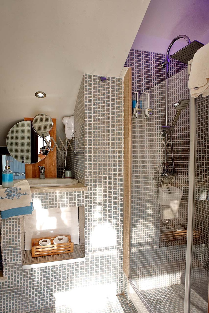 Bathroom 3 features a sink, toilet and large shower.
