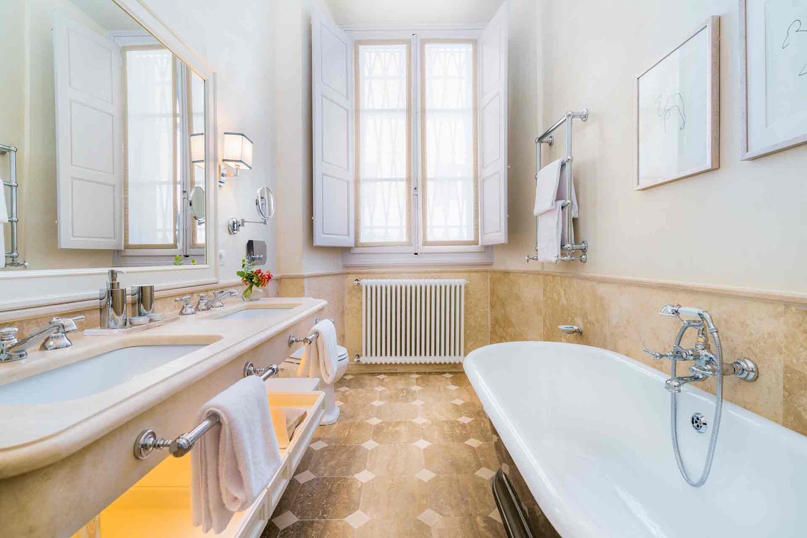 Bathroom 1 features a soaking tub, dual sinks, and shower.