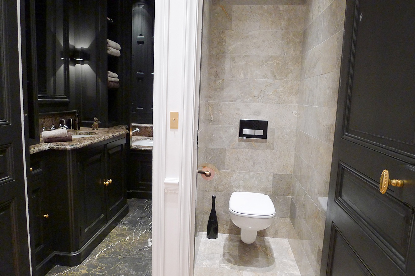 A separate half bath with toilet is conveniently located next to the bathroom.