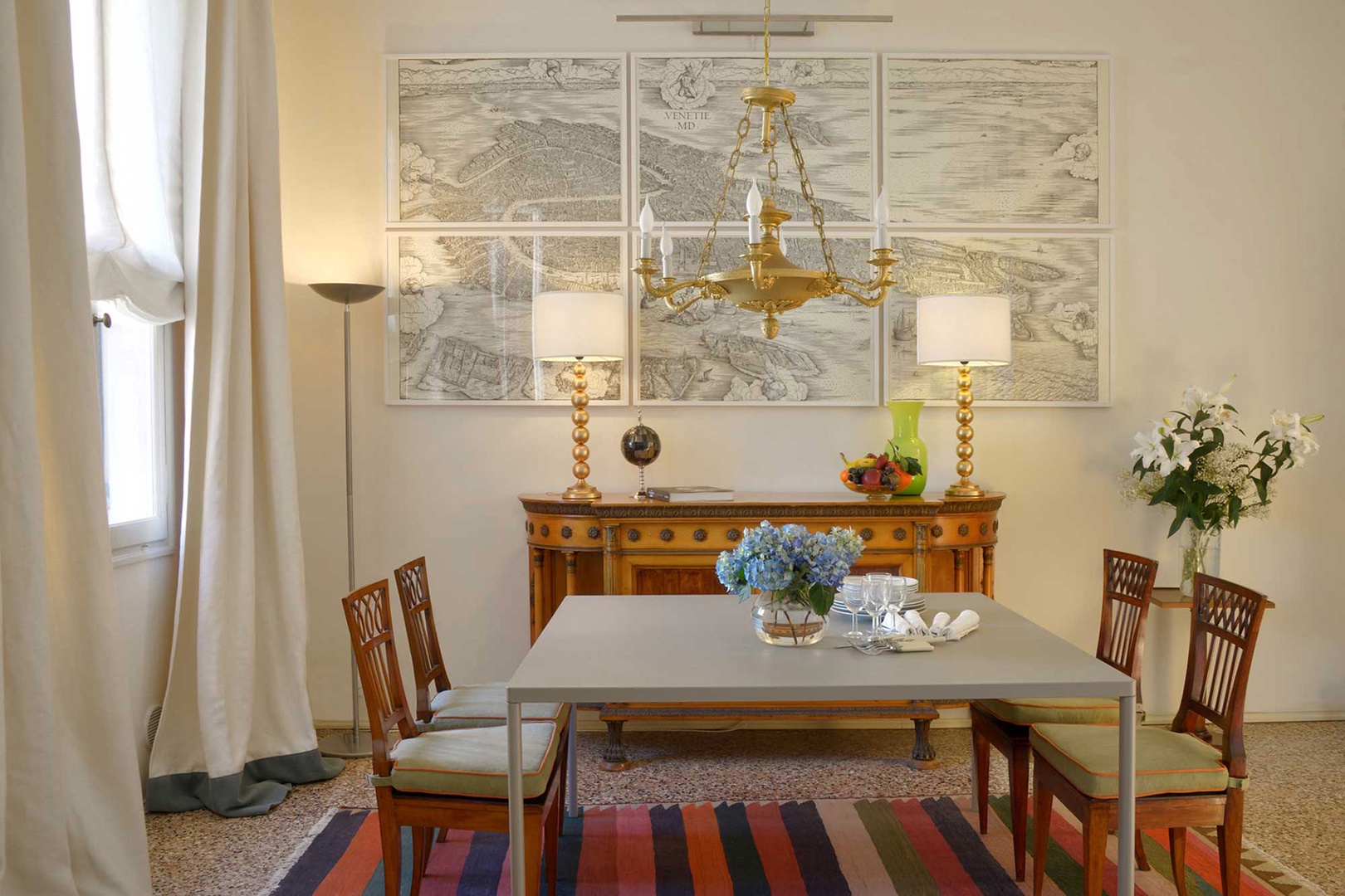 Dining room with elegant antique sideboard and specially designed chairs.