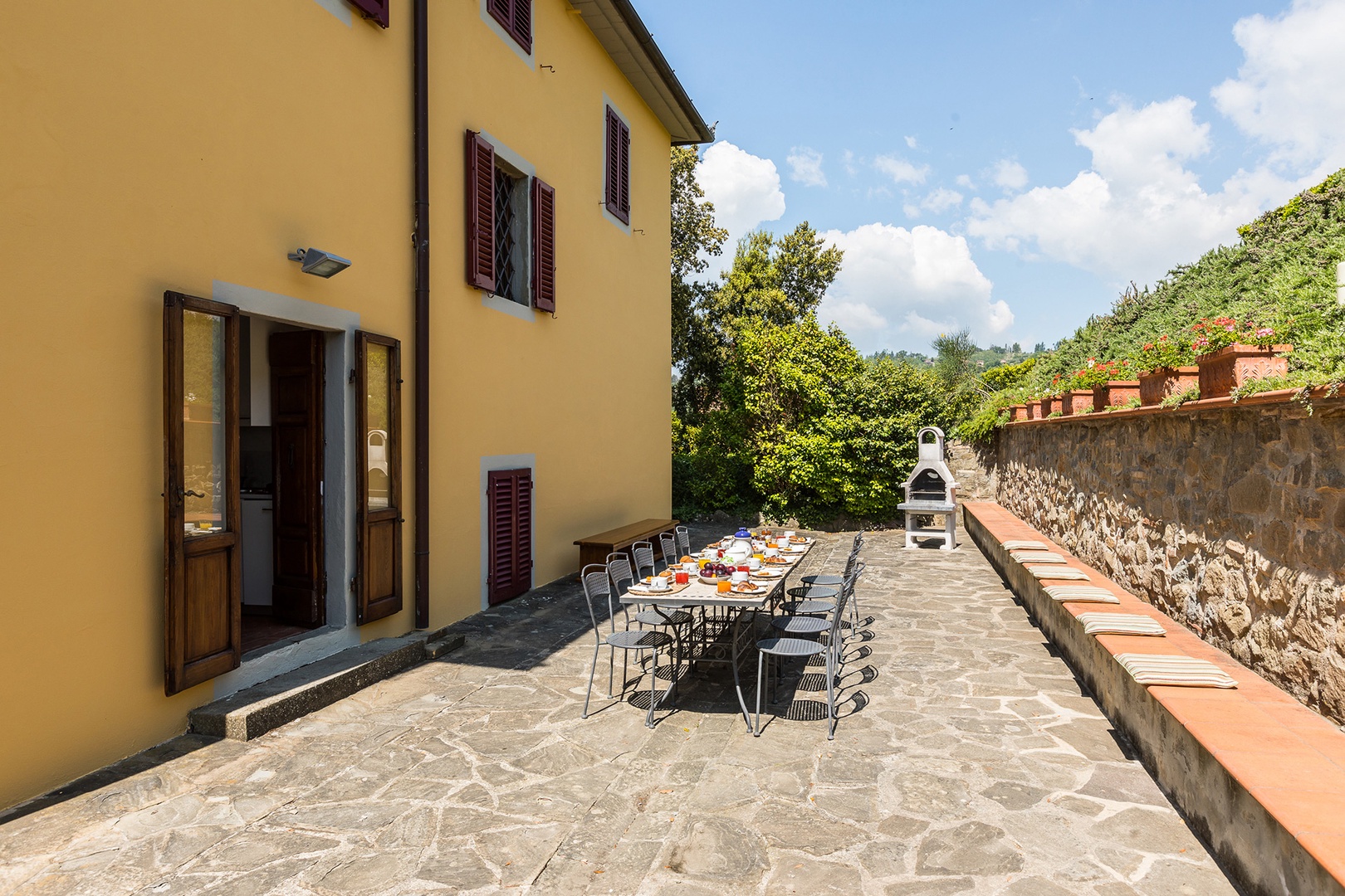 Step out of the kitchen onto this large terrace with barbecue.