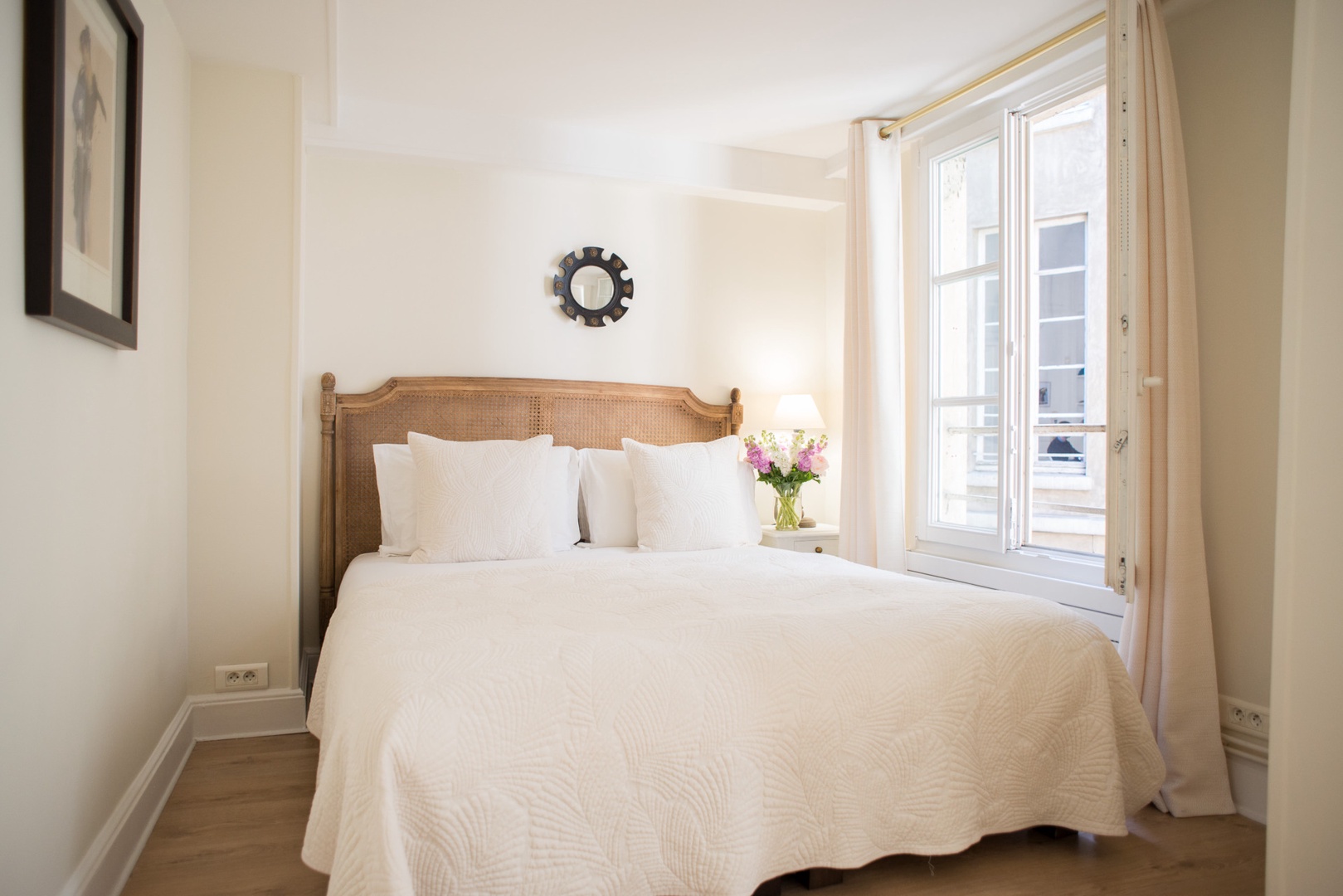 French-style bedroom 1 with a luxury bed is located on the first level.