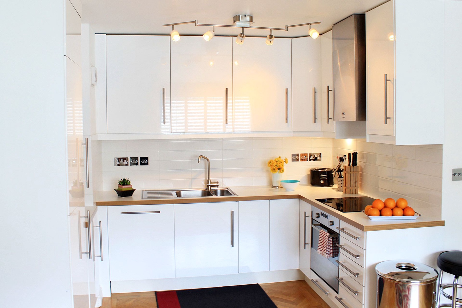 Stylish white kitchen with modern appliances