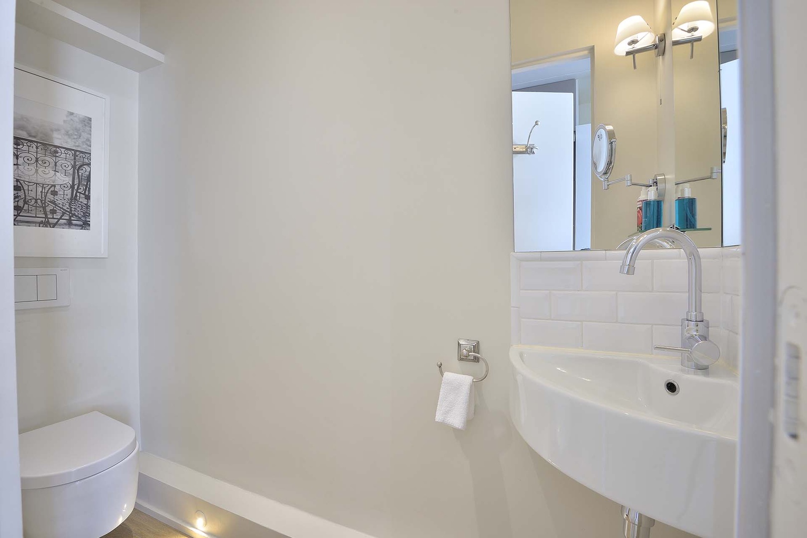 There is a practical separate half bath next to the kitchen.