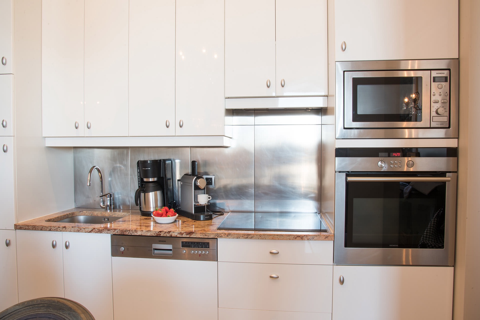 The modern and stylish kitchen is fully equipped with everything you need.