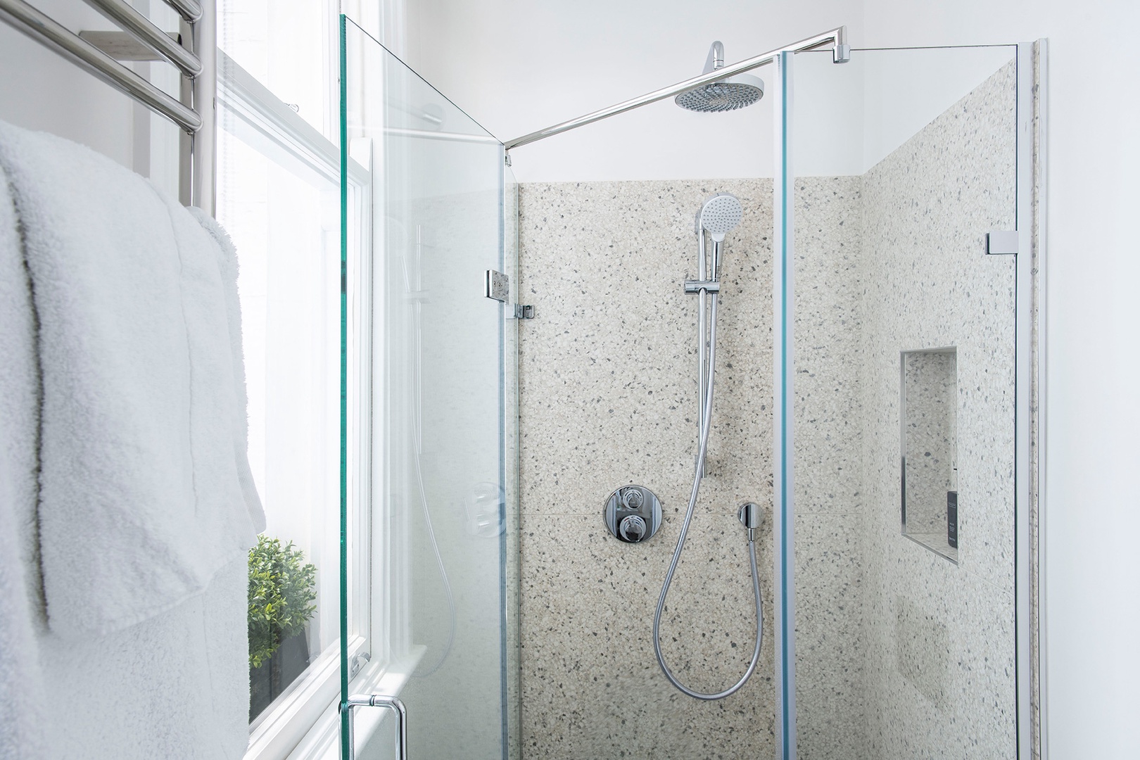 Bathroom 2 features a combination rain and hand-held shower heads.