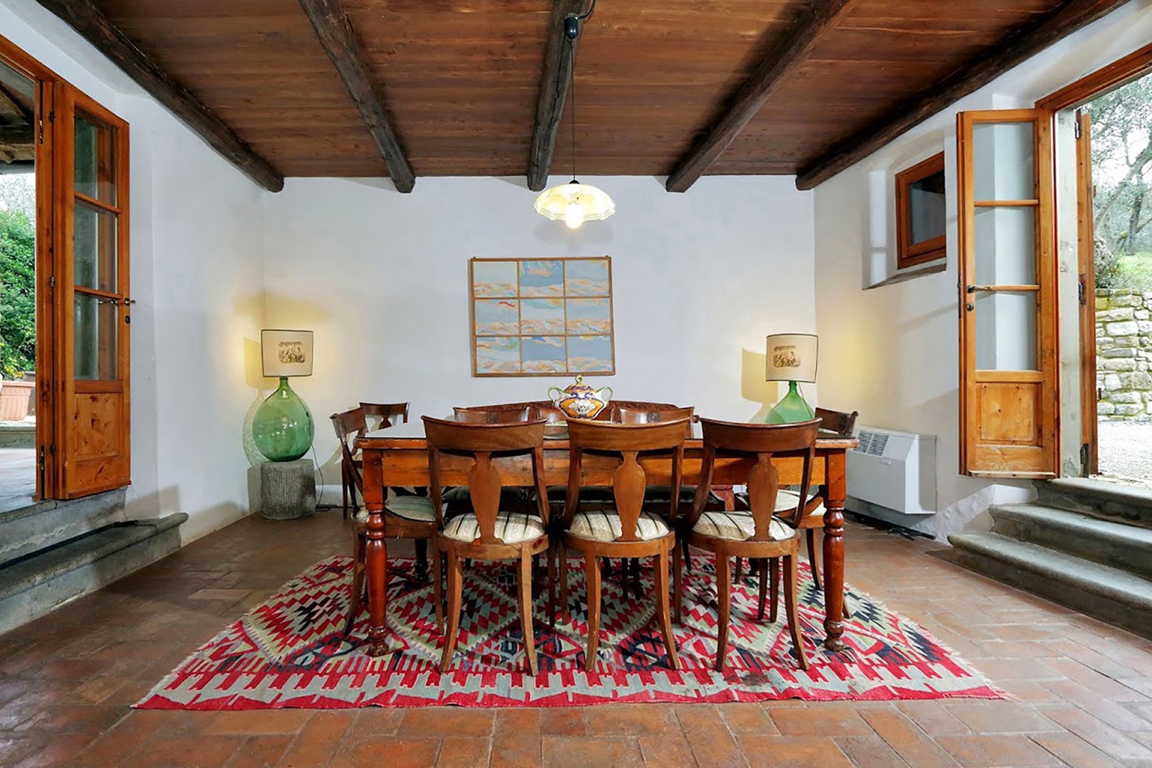 The country style dining room at Villa Poggio seats eight.