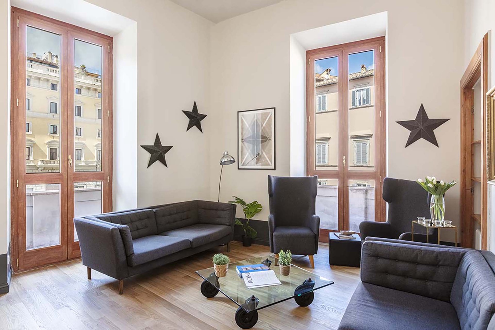 Large French doors open onto two balconies and fill the living area with light.