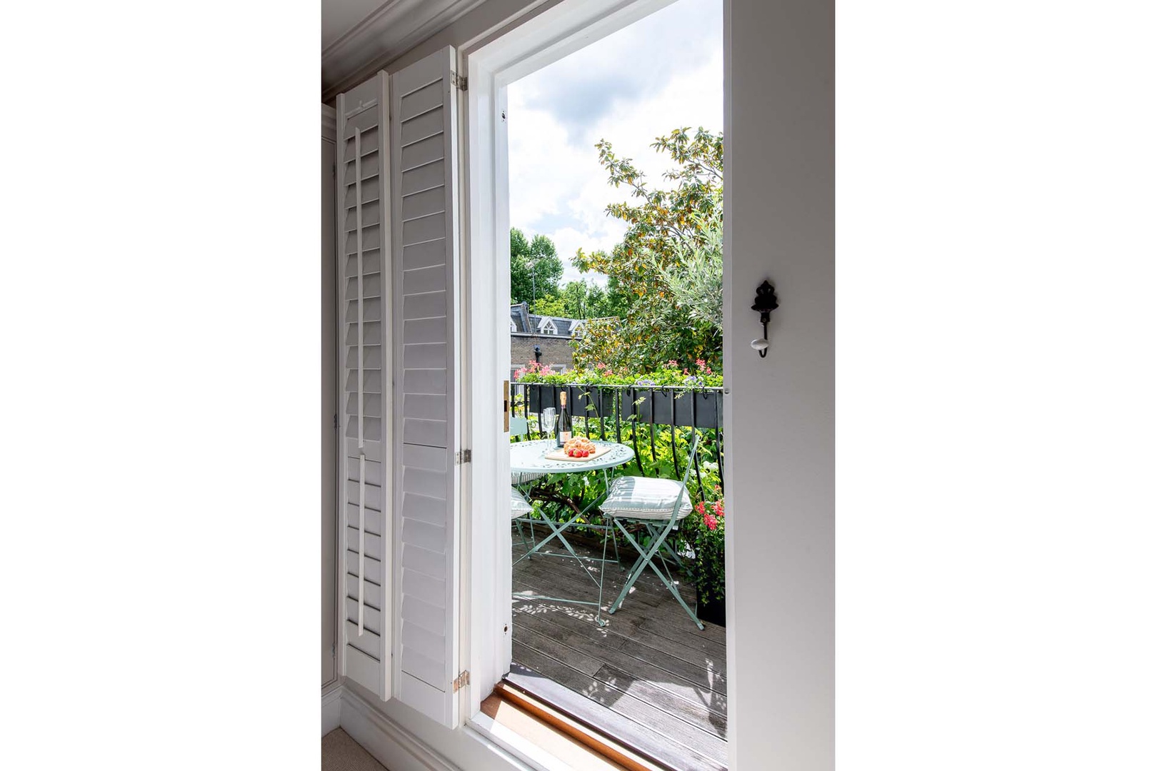 Balcony with bistro table is perfect for a morning cup of tea.