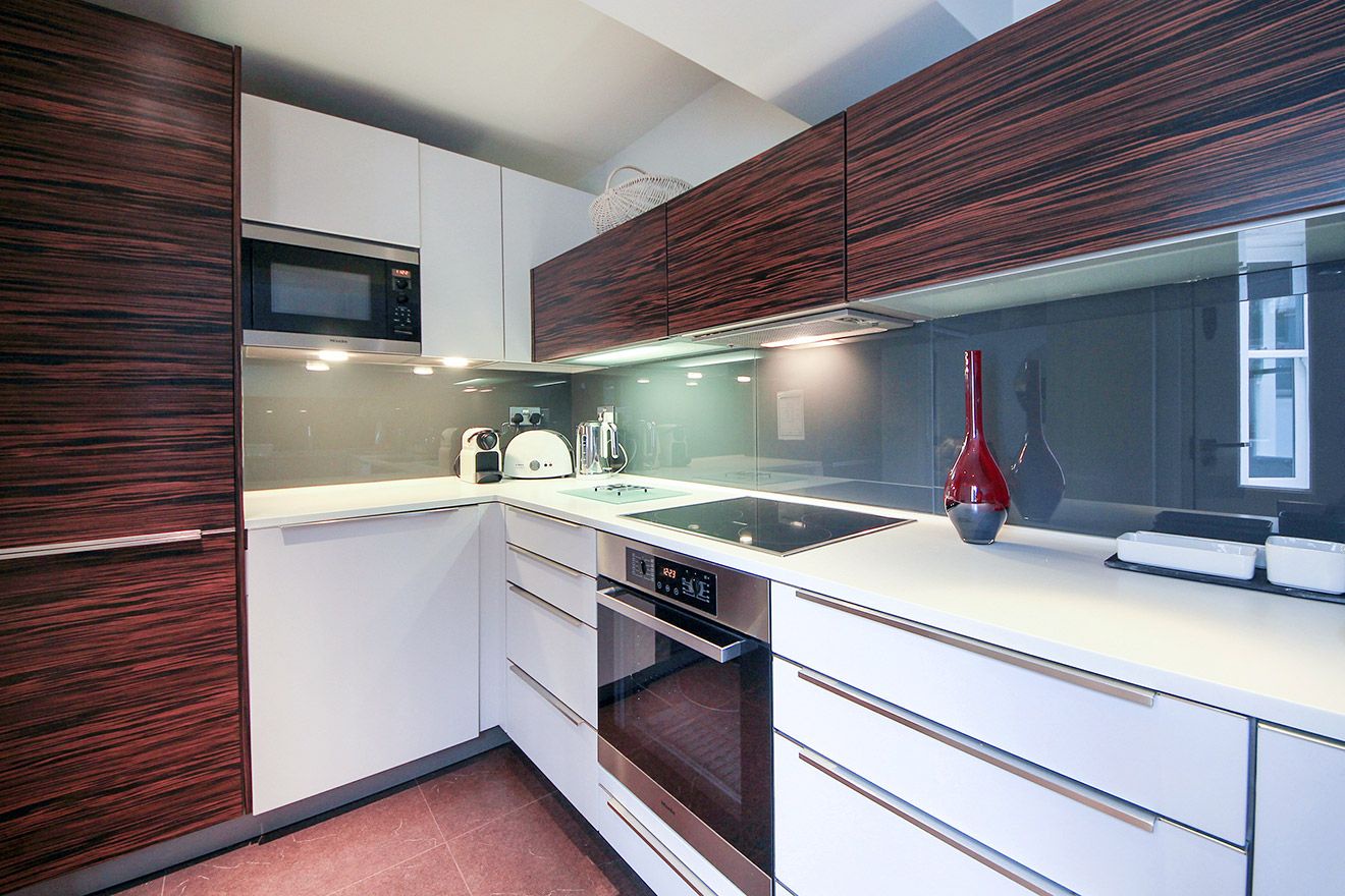 Beautifully designed modern kitchen with teak cabinets