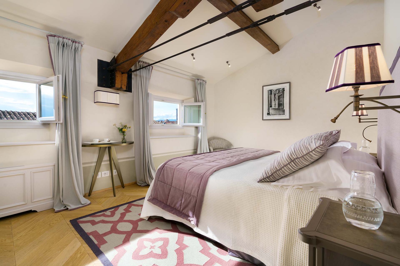 Beautiful bedroom 2 decorated with soft mauve tones.