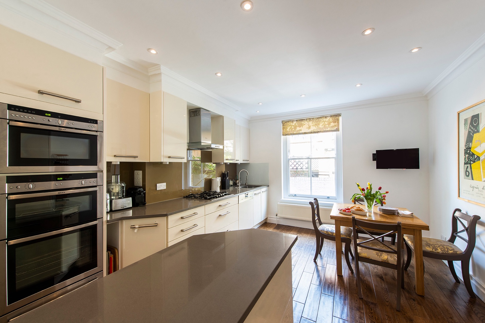 Gorgeous kitchen with large window and dining area