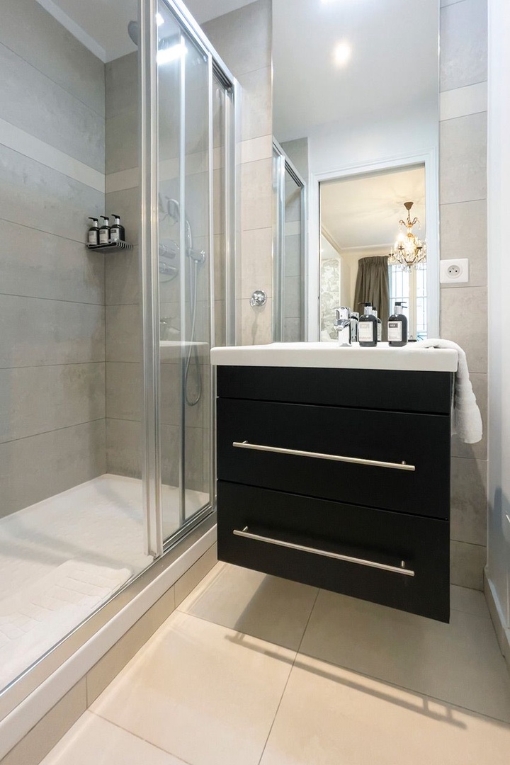 Enjoy modern amenities in bathroom 2.