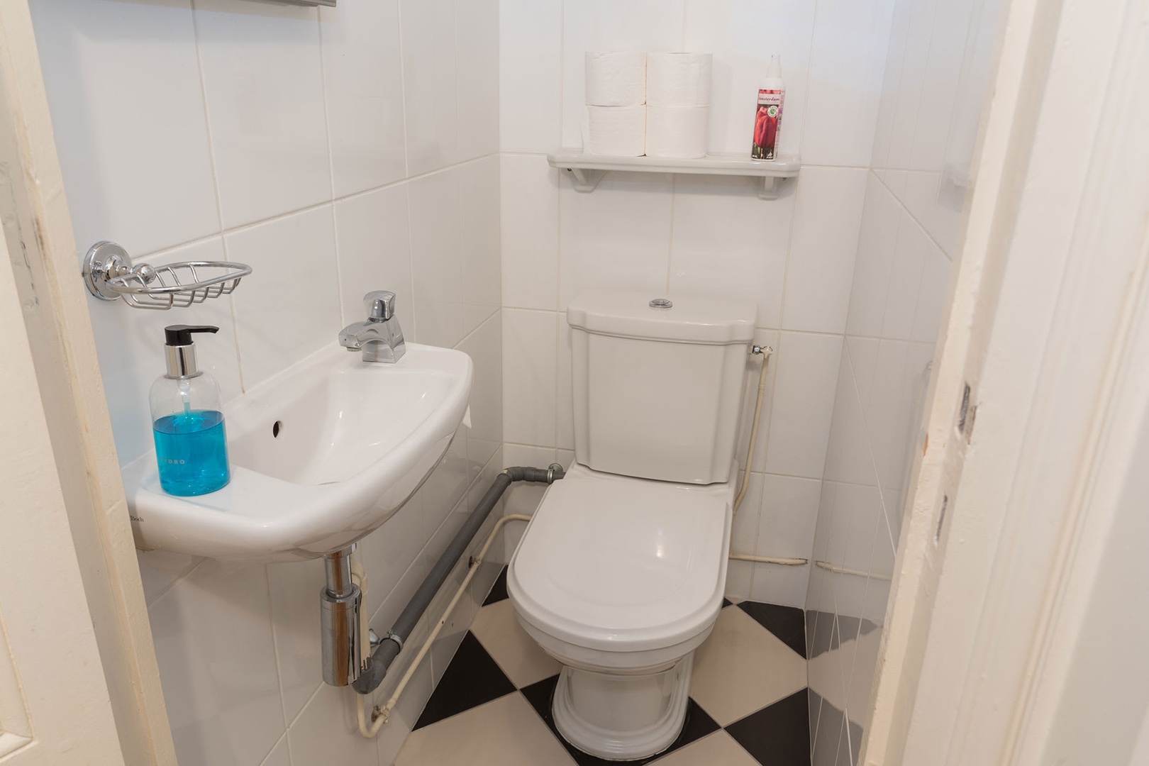 There is a separate half bath with toilet and sink next to bedroom 2.