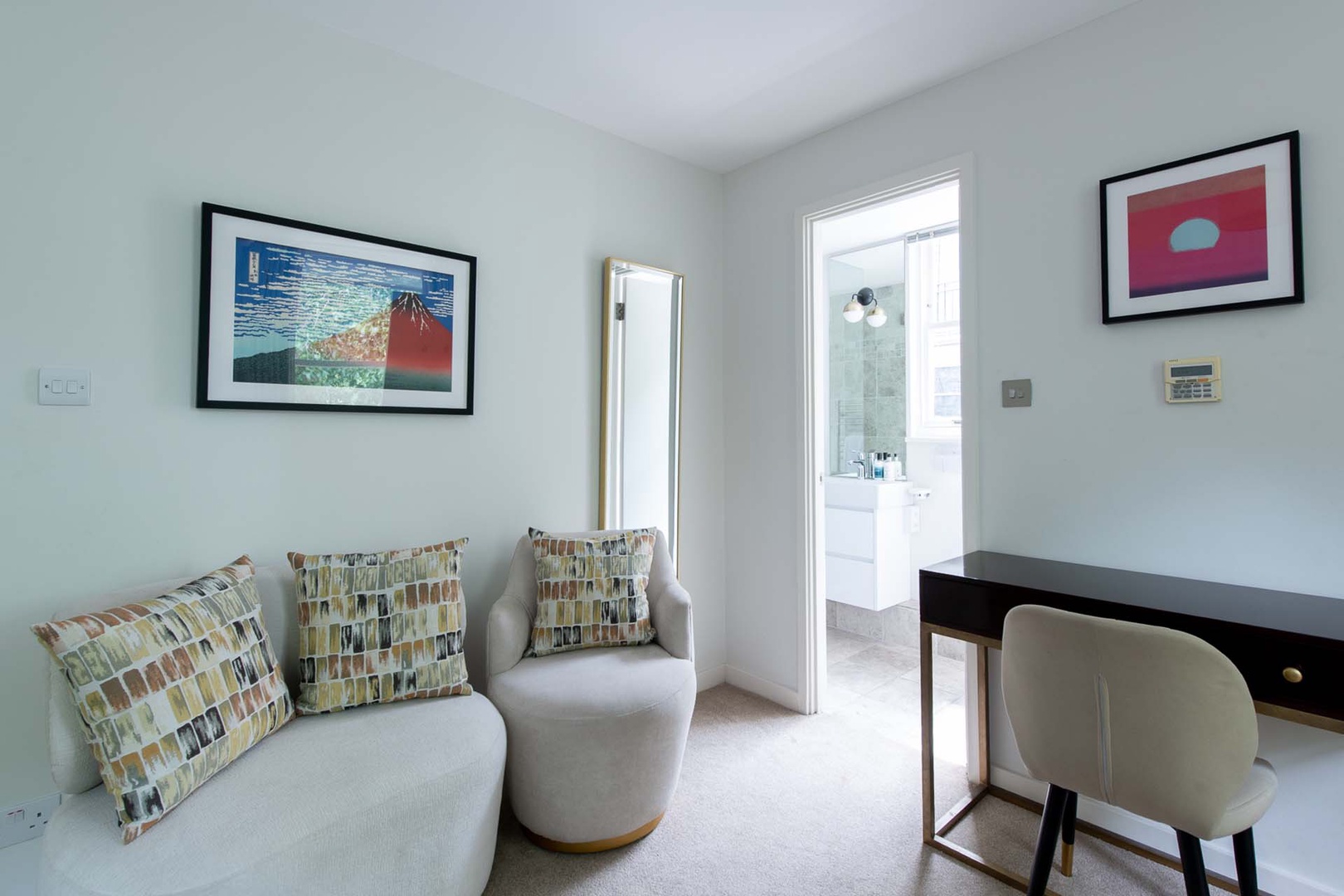Sitting area facing TV in bedroom 2.