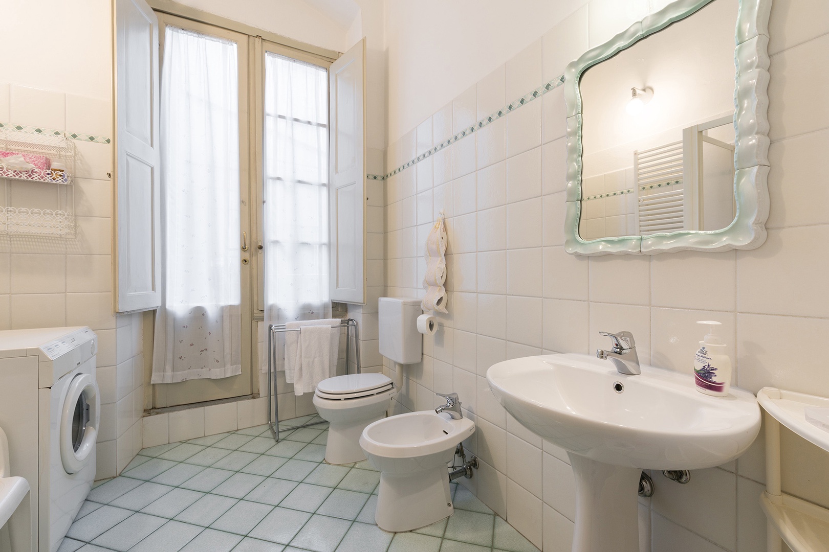 Bathroom has French doors that open to a 2nd small internal terrace perfect for hanging laundry.