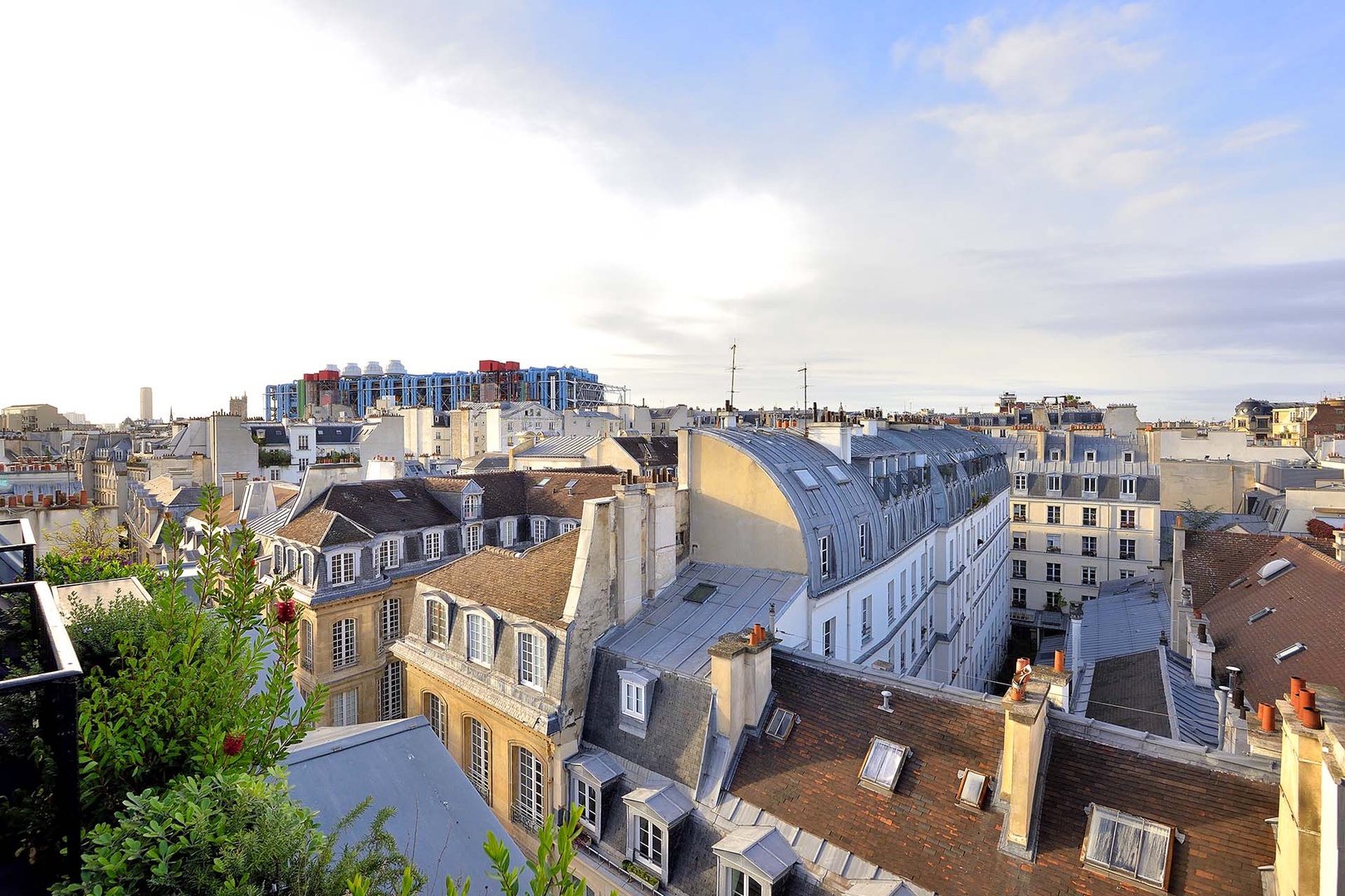 Penthouse views overlooking the historic Marais, see the colorful Centre Pompidou nearby.