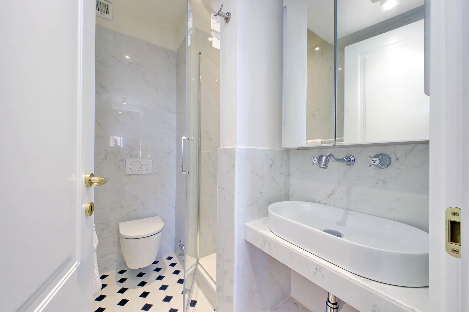 Bathroom 2 with shower, toilet and sink just off the living room..