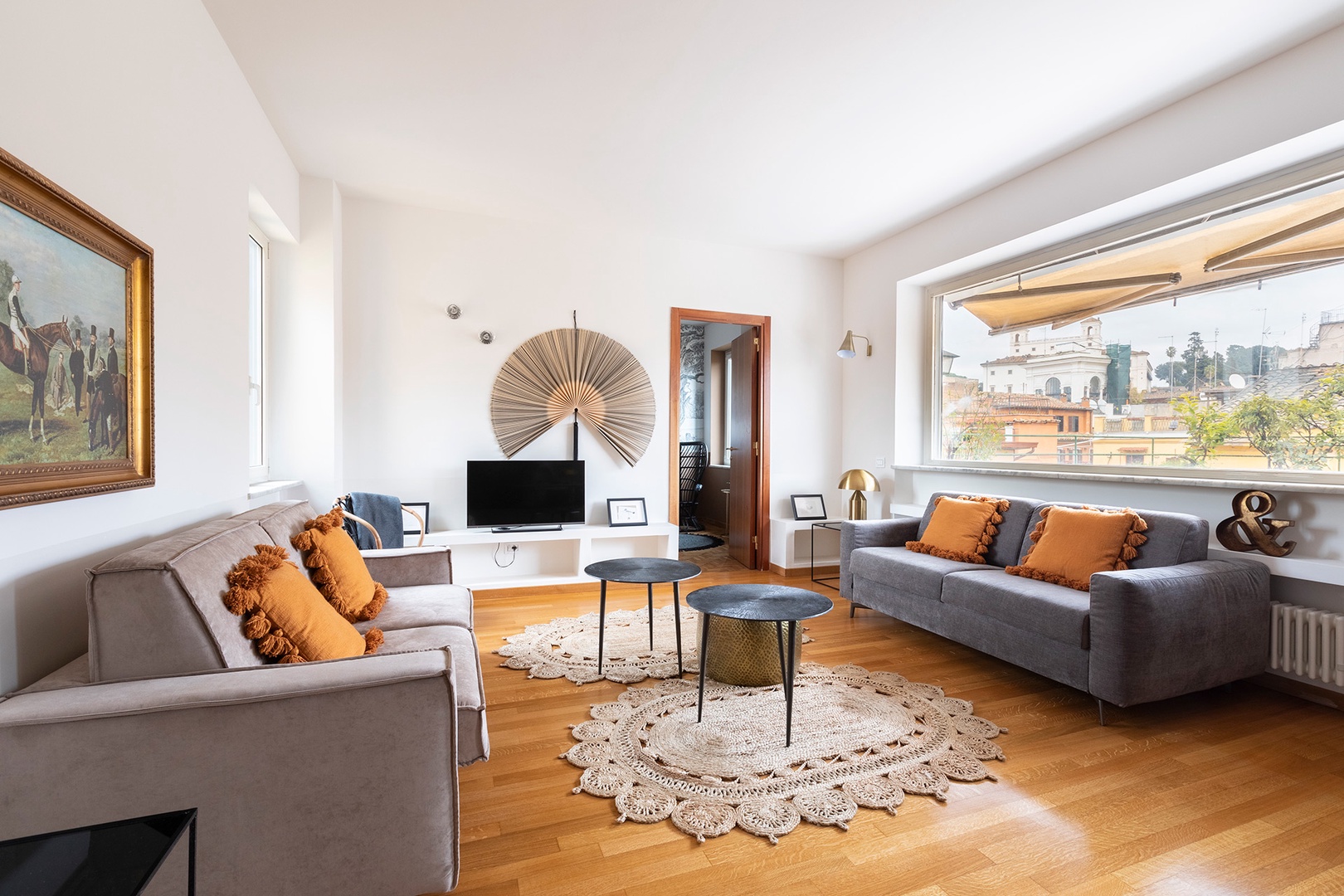 Spacious and bright living room with two sofas.