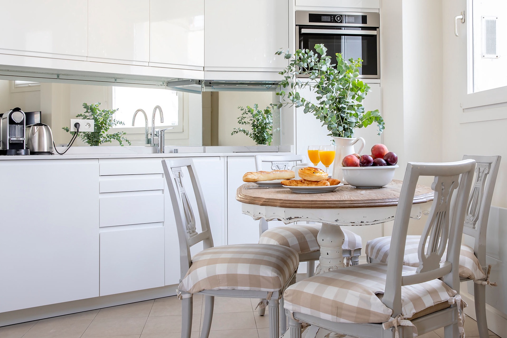 The dining area and kitchen create a cozy space to enjoy a meal.