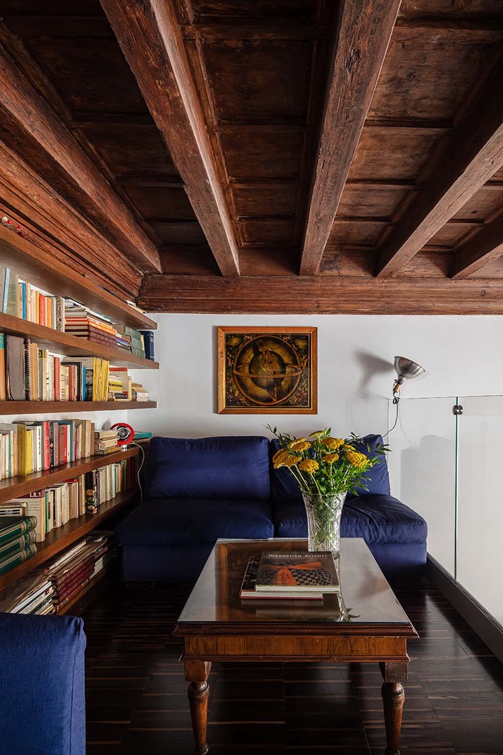 Sofa is a quiet spot to read or can be transformed into a comfortable bed.