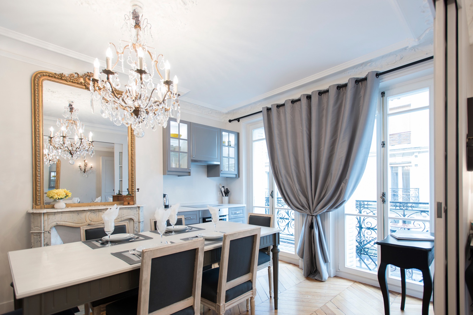 Large French doors fill the kitchen and dining area with light.