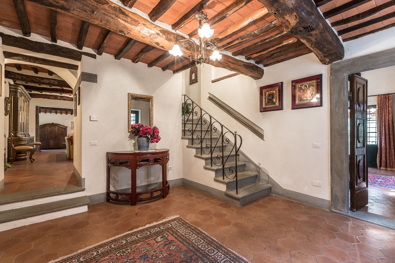 Entry foyer with handsome terra-cotta tiles.