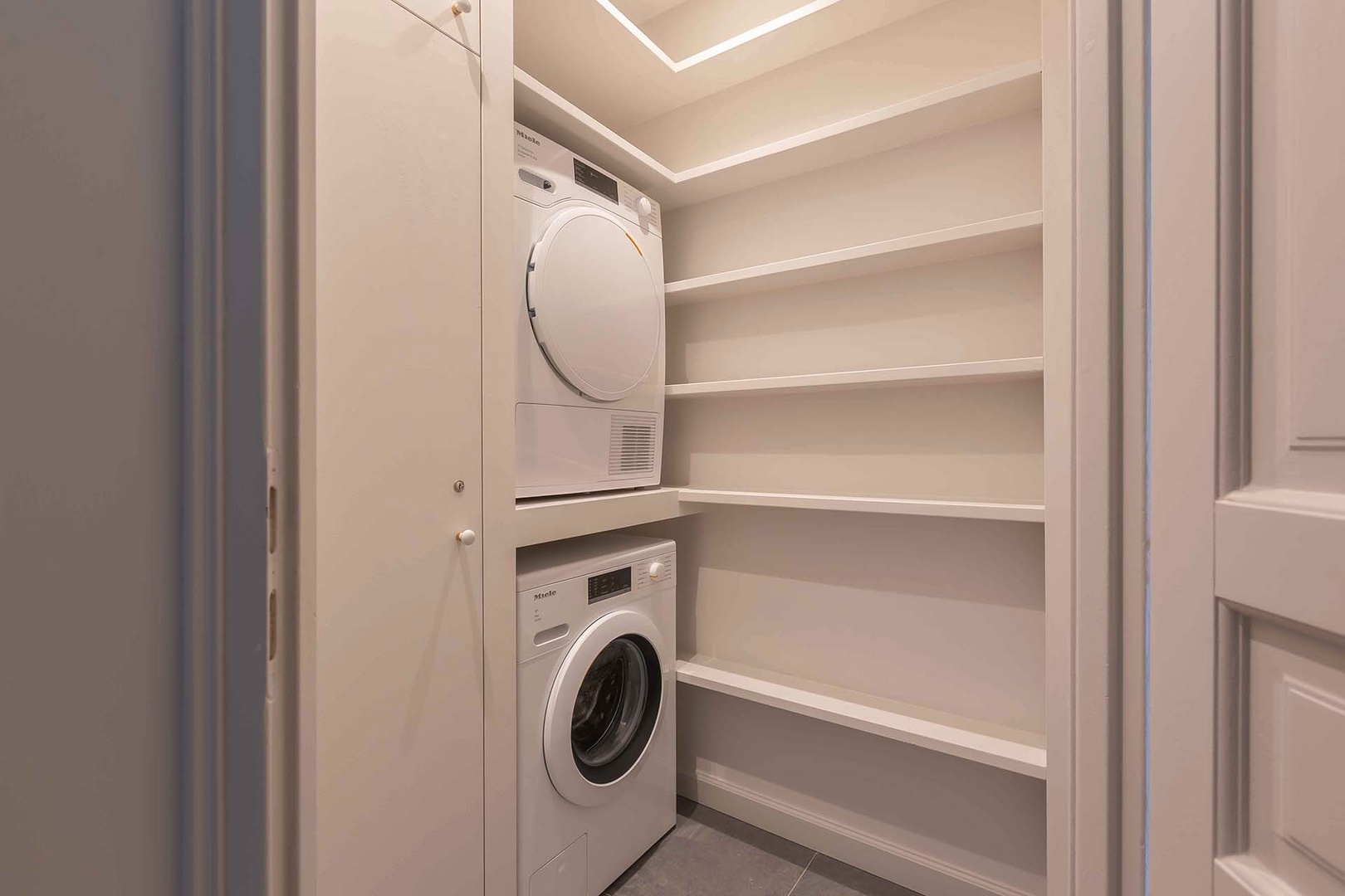 Utility room with separate washer and dryer.