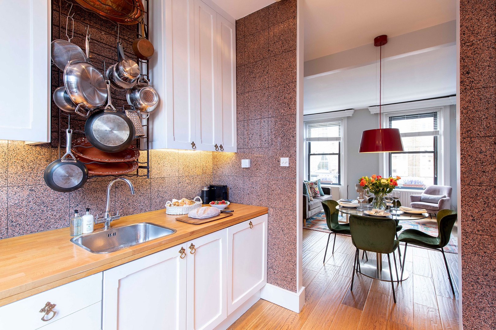 Kitchen is fully equipped for cooking at home.