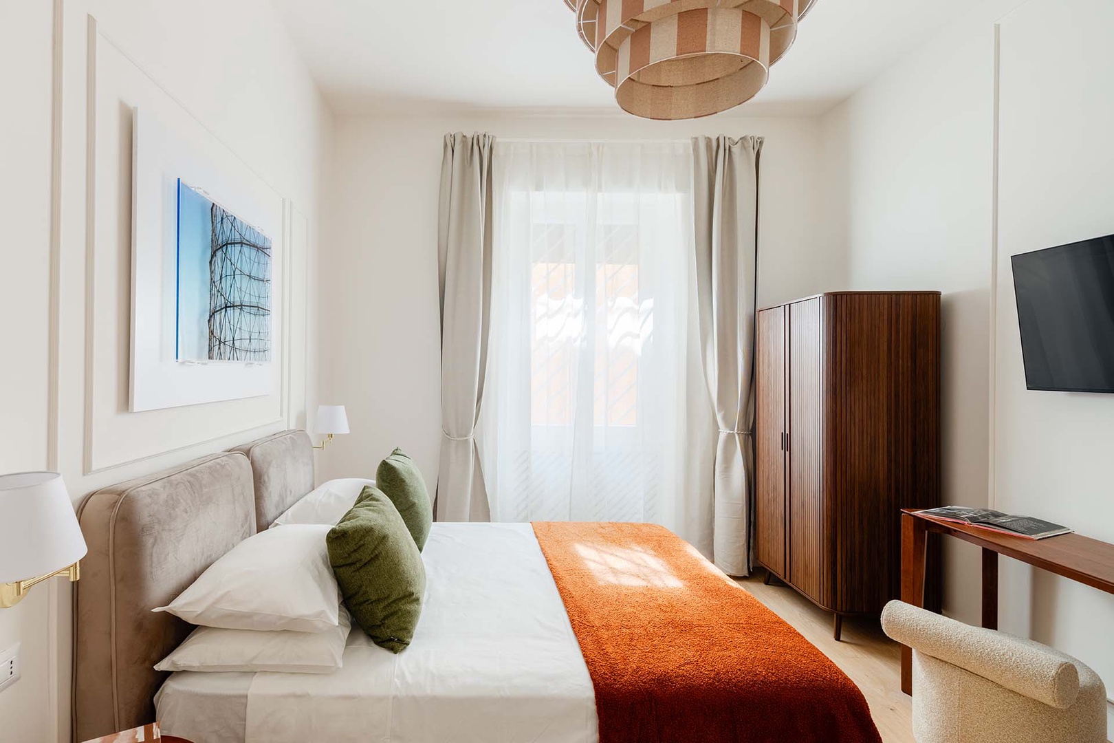 Large window and serene decor.