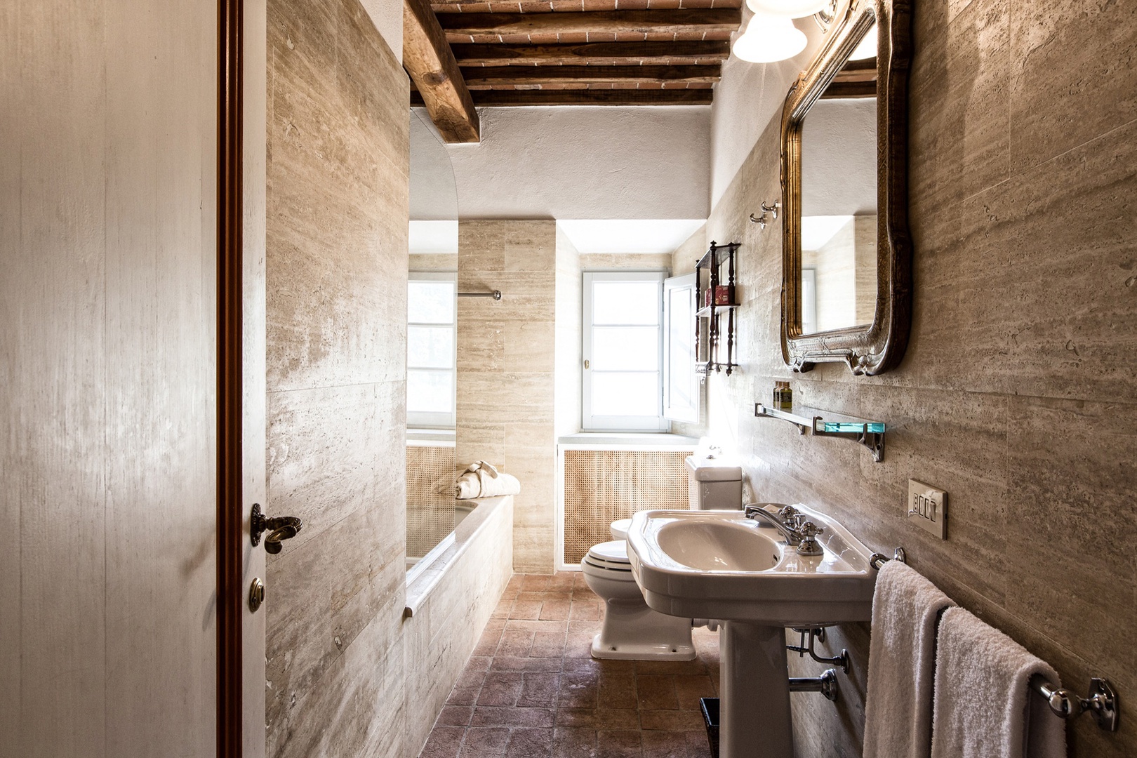 Rustic charm in each of the en suite bathrooms of this villa.