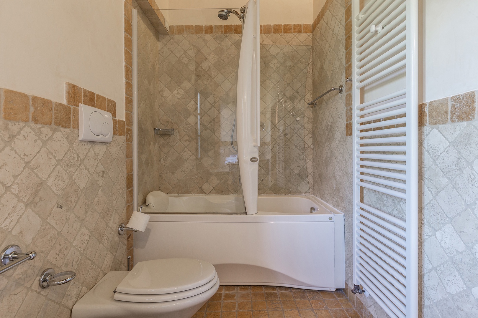 En suite bathroom to bedroom 1 features a jacuzzi bathtub and shower.