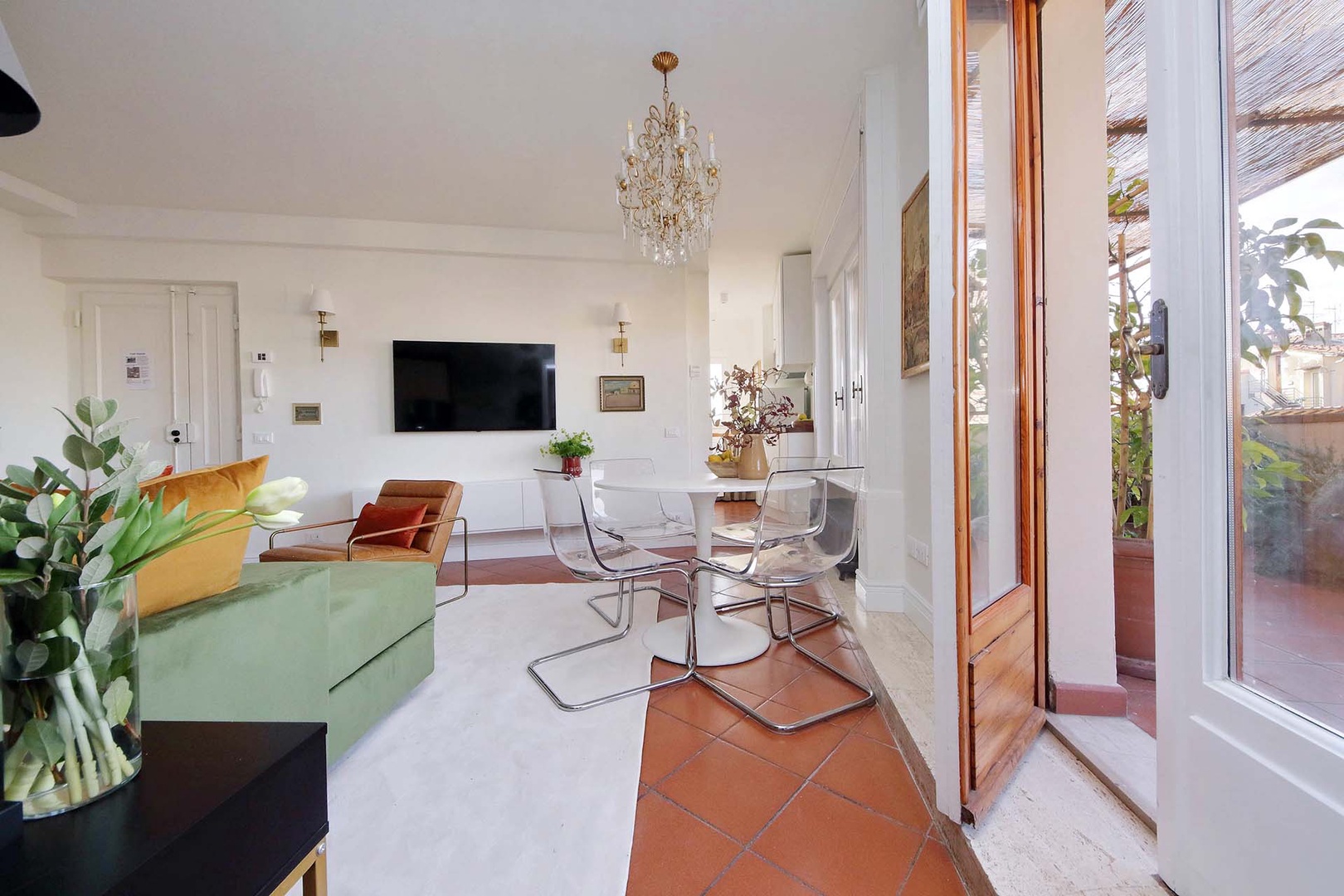 Large French doors open off the dining area to the expansive terrace.