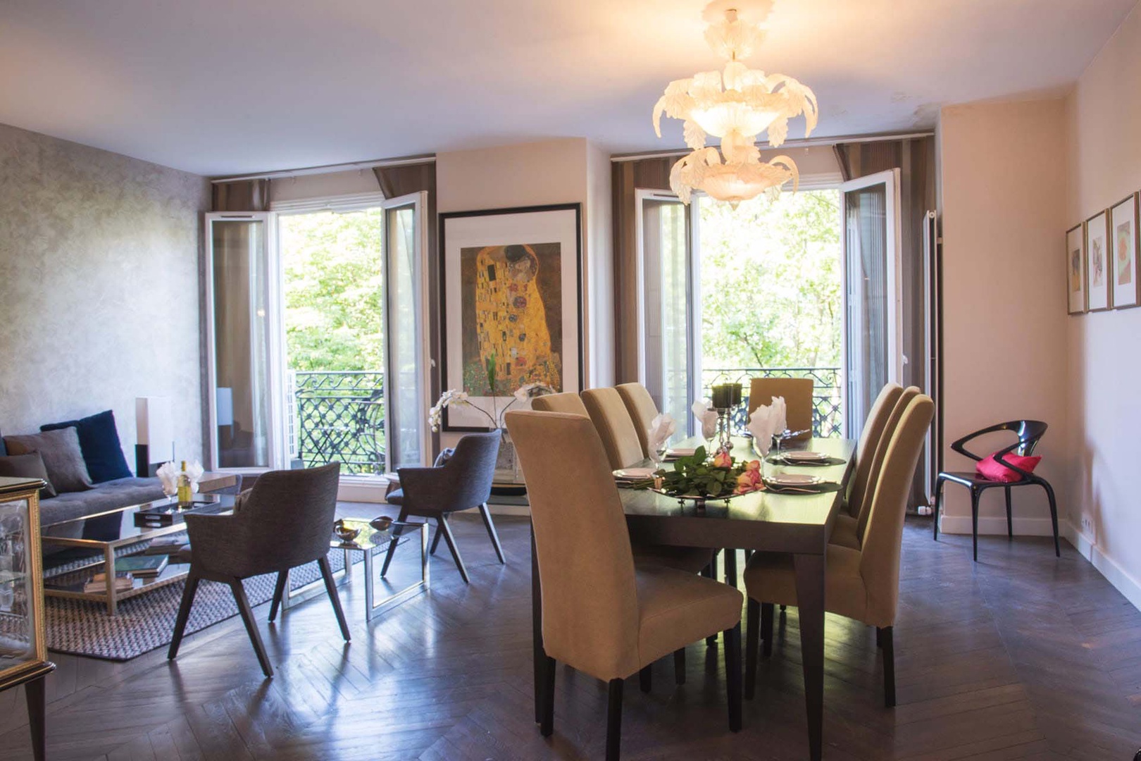 Grand French-style double living room is full of light.