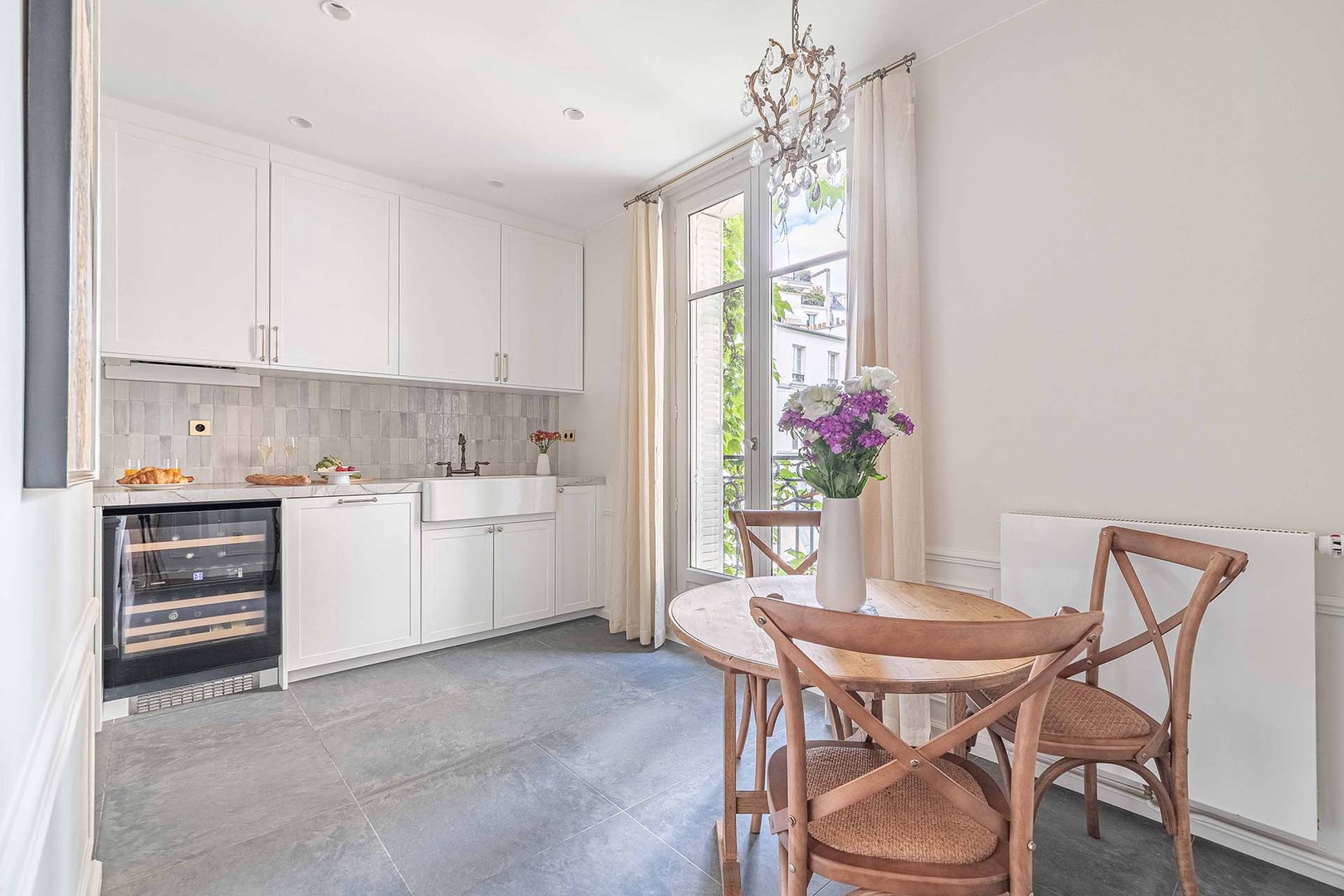 Fully equipped gourmet kitchen has dining nook.