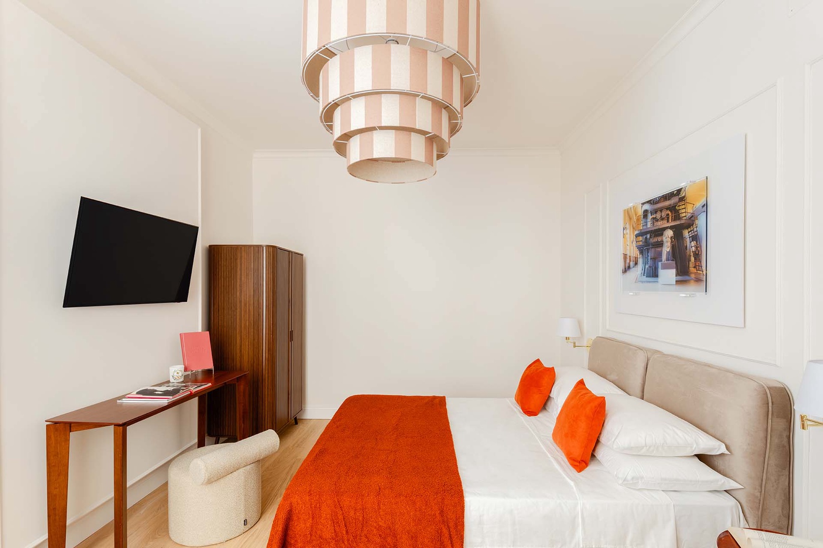 Each bedroom has a wall-mounted TV.