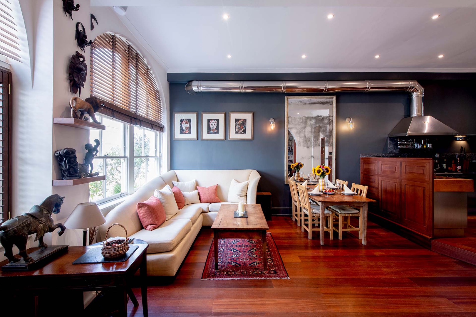 Large living and dining area opens to a modern kitchen.