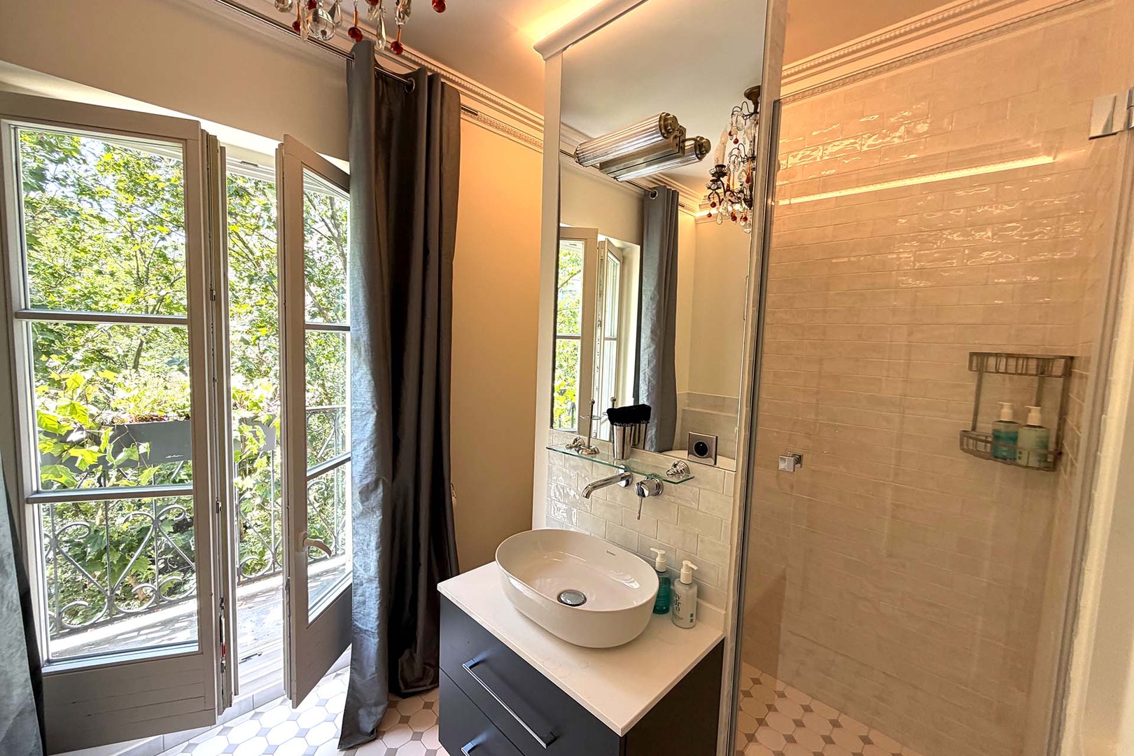 The bright bathroom also features a large shower.