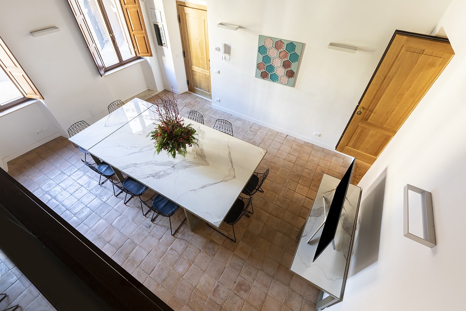 Large dining table on the first floor perfect for enjoying meals together.