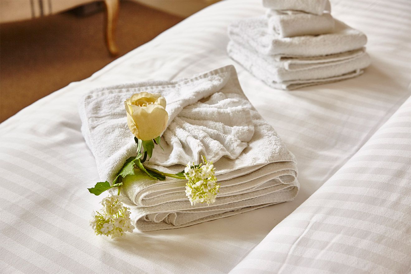 Tuck a rose into your towels for a romantic touch!